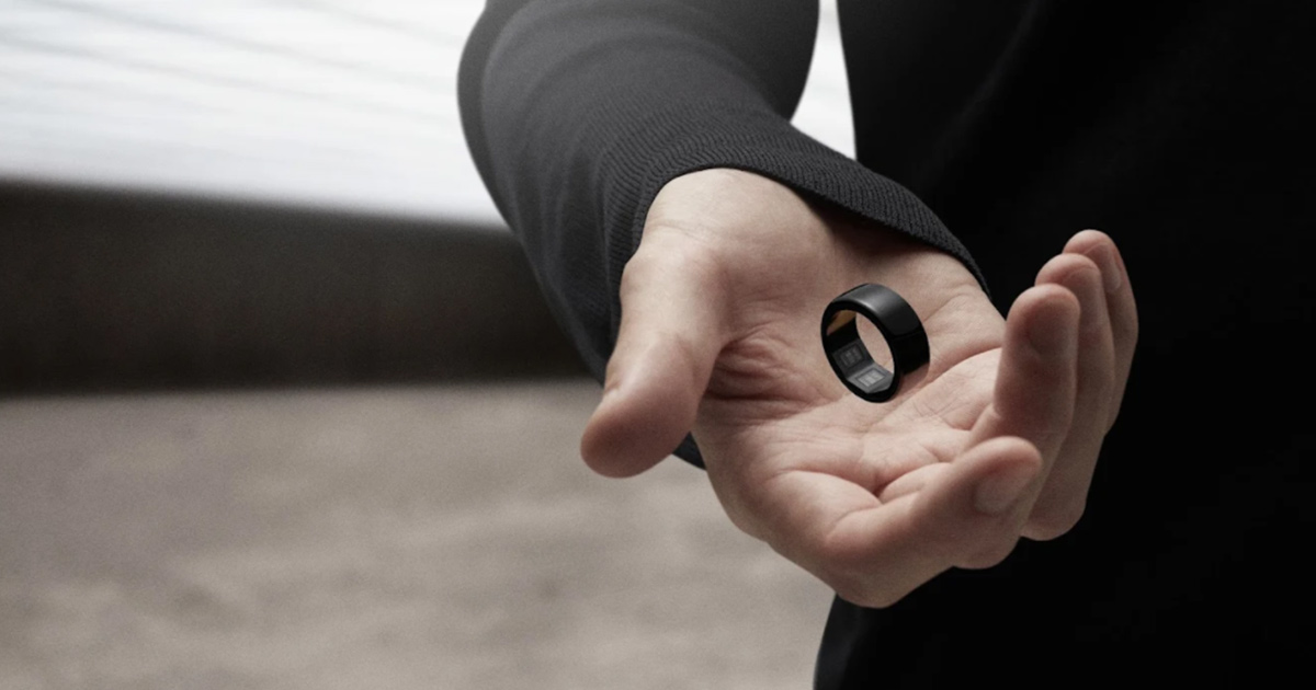 Hand holding metallic ring