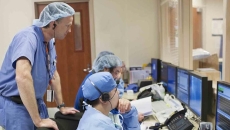Healthcare workers looking at a computer