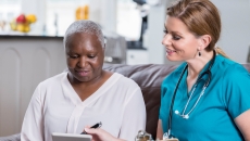 Healthcare professional and patent in an in-home visit