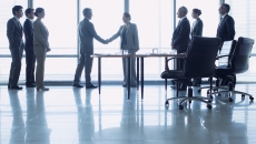 Executives discussing business deal