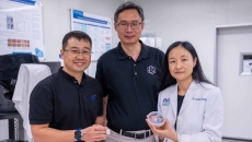 Representatives from NTU Singapore, Procter &amp; Gamble, and Agency for Science, Technology and Research pose side-by-side while showing the HapSense ring-type device for skincare cosmetic product analysis.