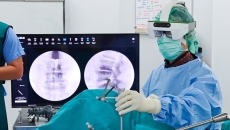 A surgeon performing a surgery using an augmented reality-based navigation system