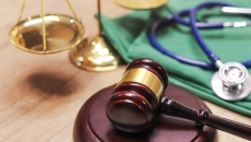 A gavel next to a stethoscope