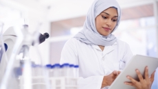 Researcher looking at an iPad