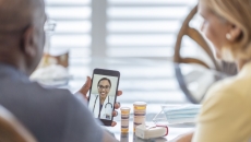 People interacting with a healthcare professional via a smart phone