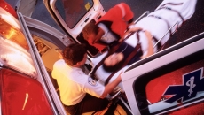 Paramedics loading a patient onto an ambulance