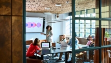 A woman pitching her startup to partners