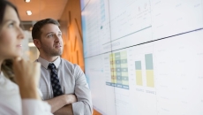 Businesspeople looking at financial results