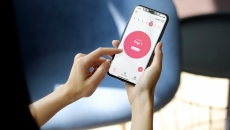 A woman using the Flo period tracker