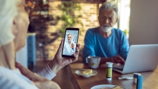 An older couple talking to a provider via telehealth