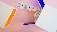 PillDrop's dispenser with a roll of sorted and individually labelled sachets of medication