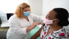 A healthcare provider administering a vaccine.