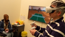 A volunteer participant of the Flinders University research using VR to do an exercise