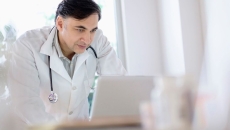 Healthcare provider looking at a computer