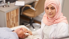 Healthcare professional performing an ultrasound on a patient