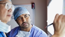 Two clinicians analysing an x-ray image