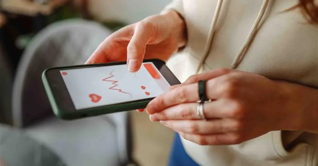 A person looking at data on a smart phone