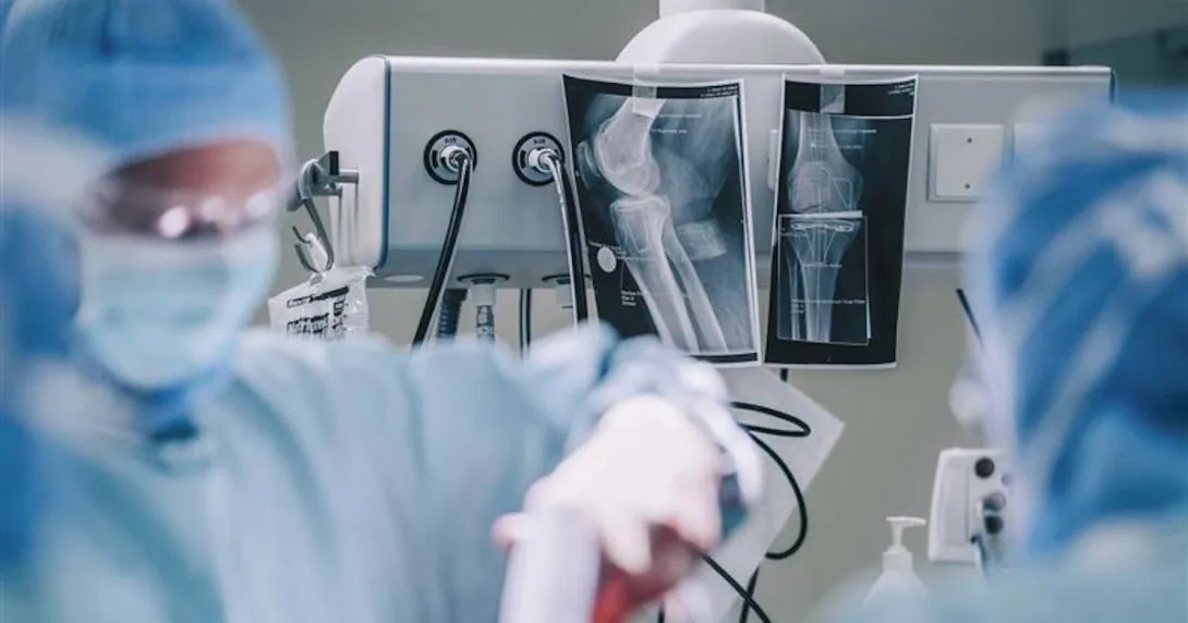 Surgeons doing operation in hospital operating room