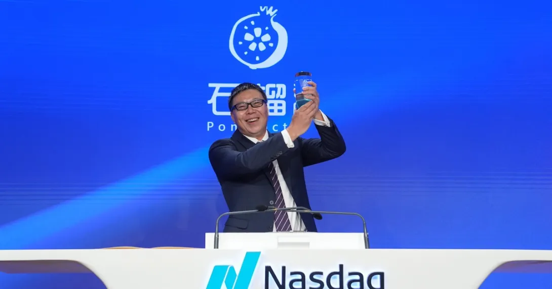 Zhenyang Shi, chairman and CEO of PomDoctor, rings the opening bell following their company's Nasdaq debut