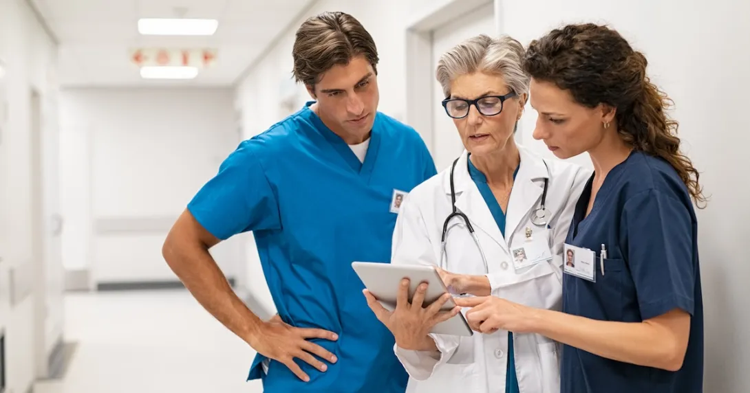 Healthcare providers standing in a hallway in a clinic