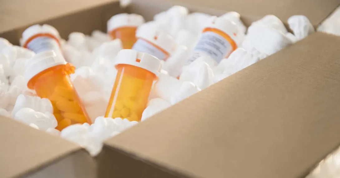 Prescription drug bottles in a box