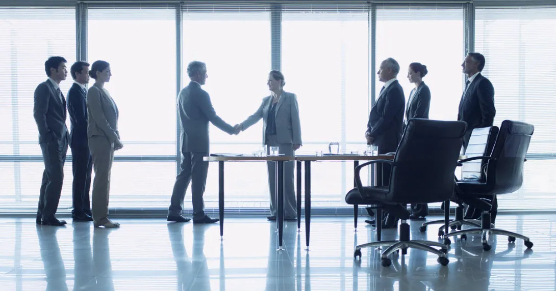 Business people closing a deal after a meeting