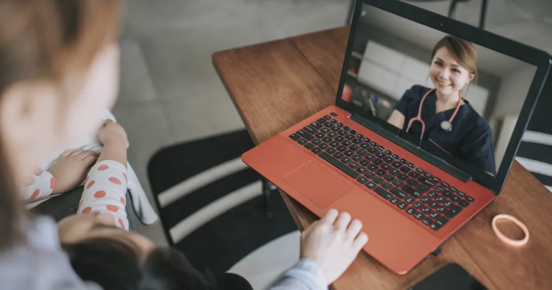 Healthcare professional interacting with a patient via telehealth platform