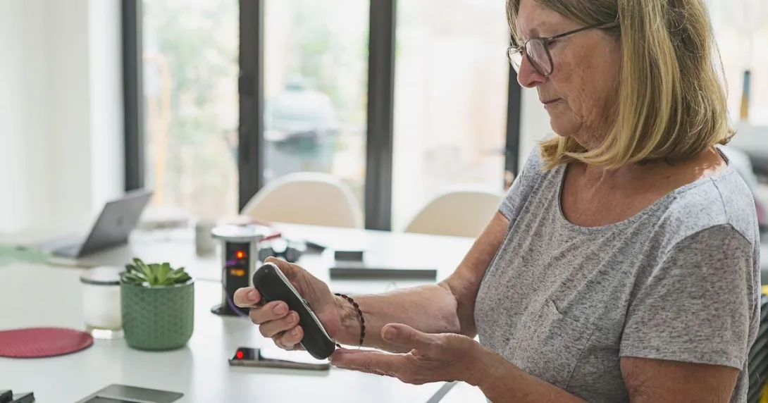 A woman checking her blood sugar.