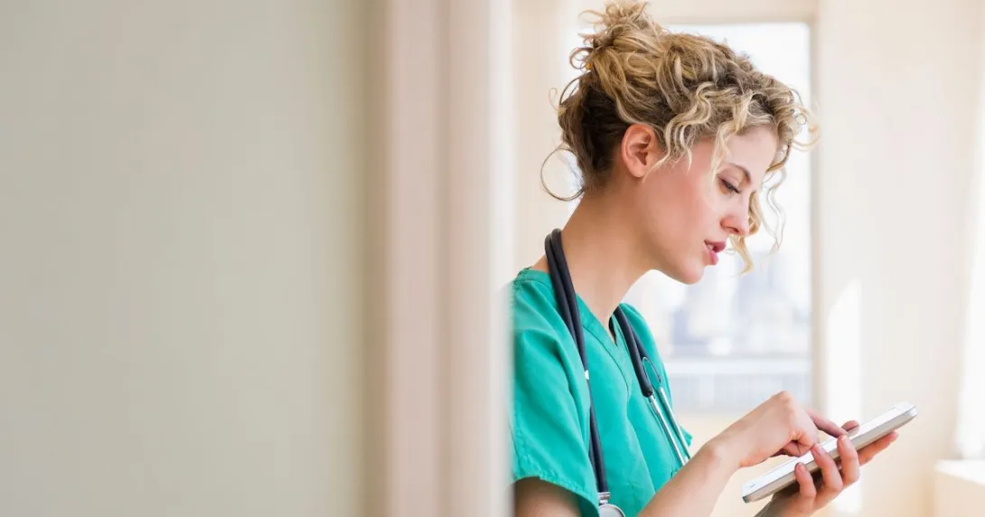 A provider typing onto a tablet