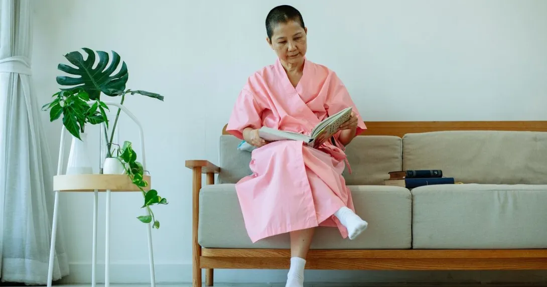 An elderly person reading a book