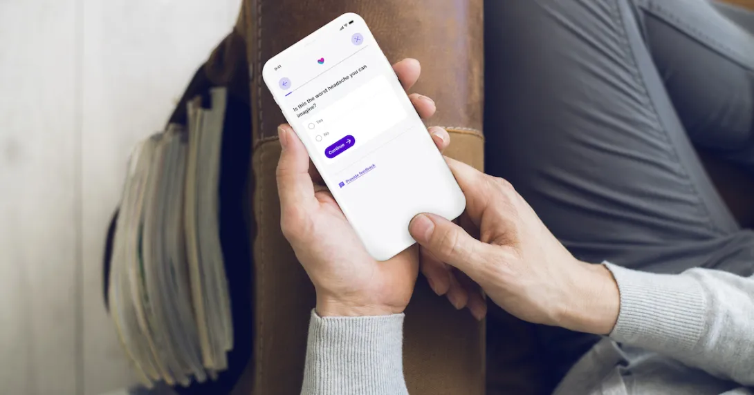 A close up of a person using Babylon's Symptom Checker on a smartphone