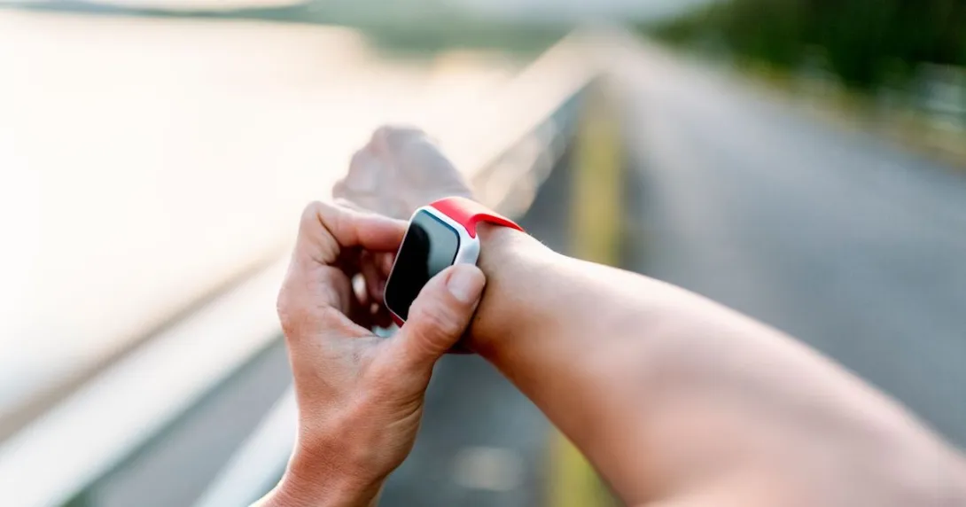 A person's arm with a smartwatch on their wrist