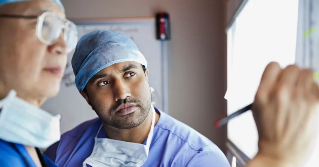 Two clinicians analysing an x-ray image