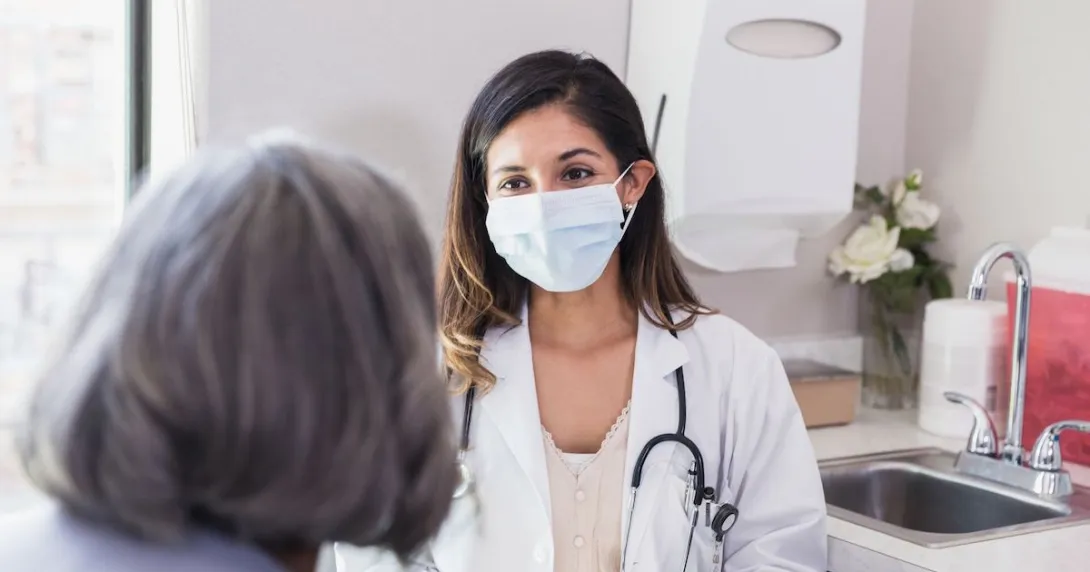 A doctor consulting with an elderly patient